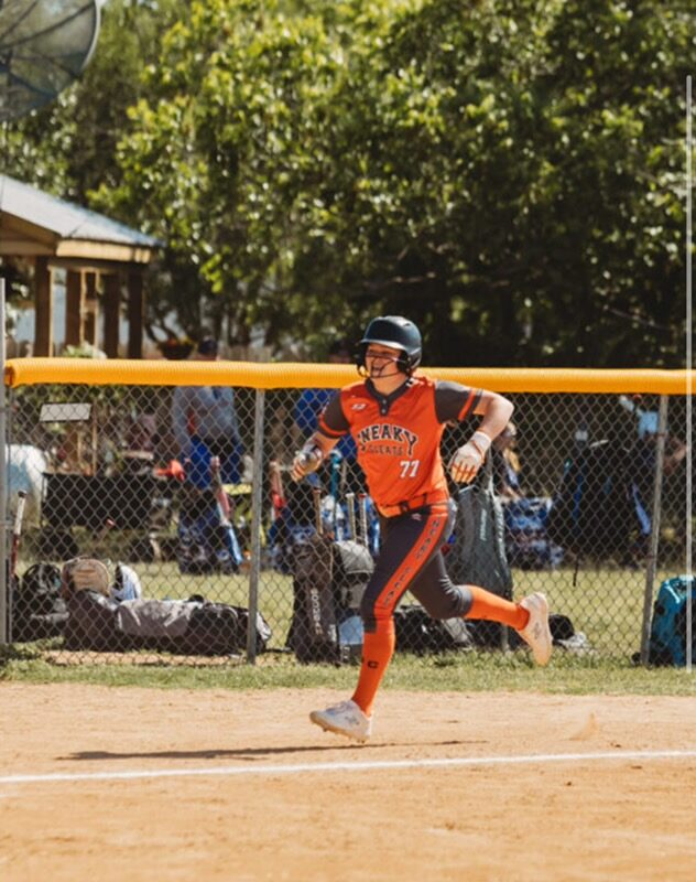 Adeline Camden running to first base